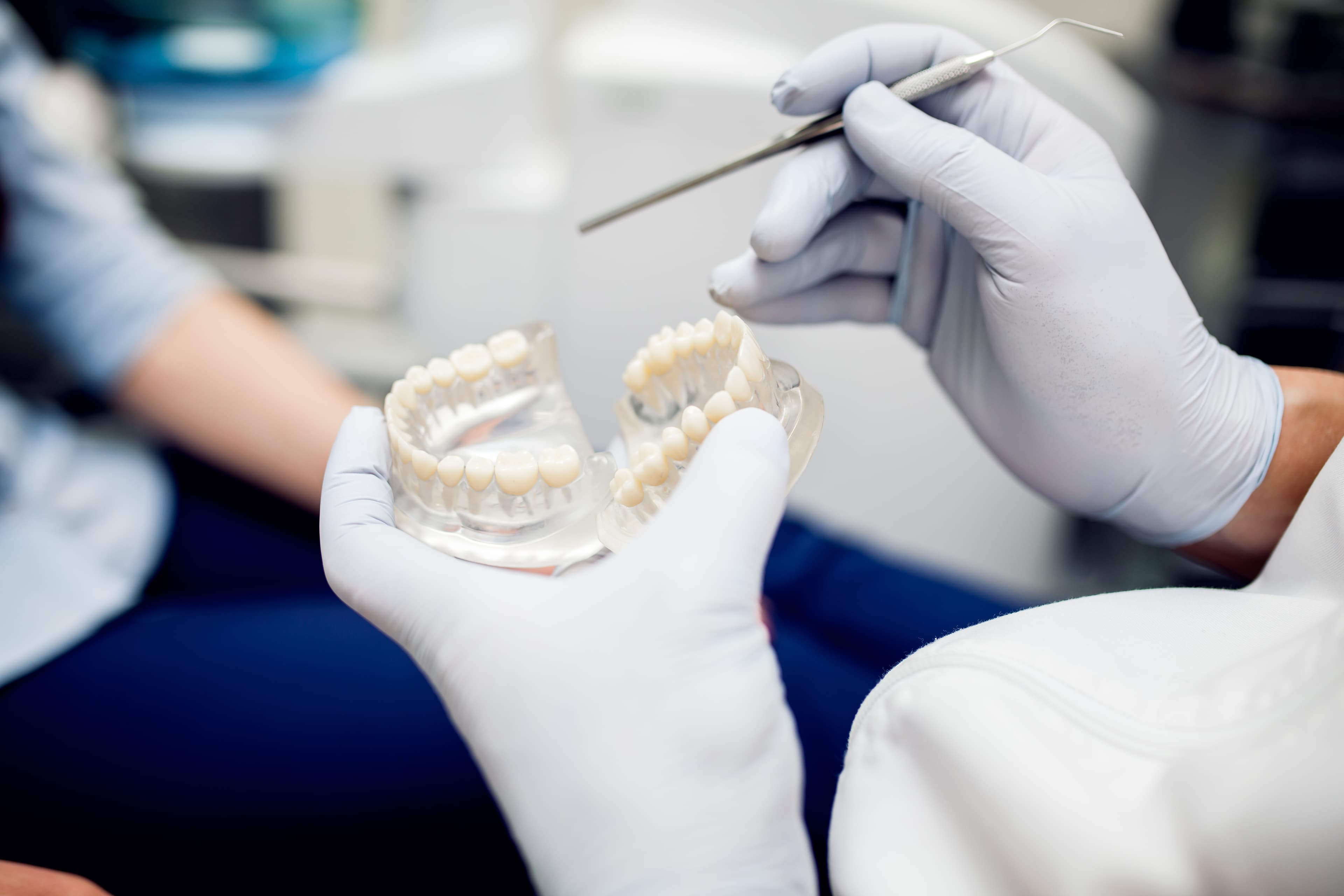 Confident male patient with dental implants, age 55