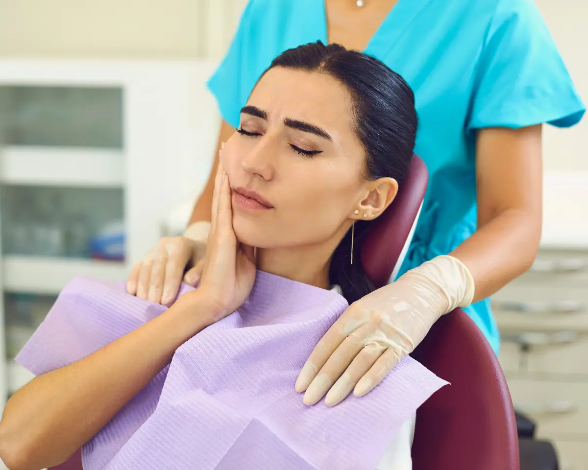 Dentist reviewing cracked tooth findings with a patient at a consultation appointment