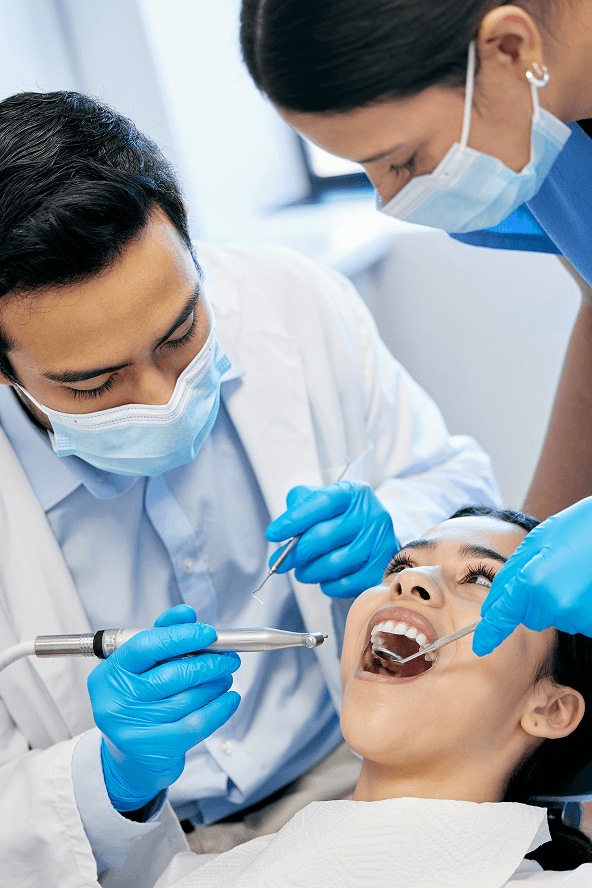 Dentist providing care to a patient at Silver State Smiles